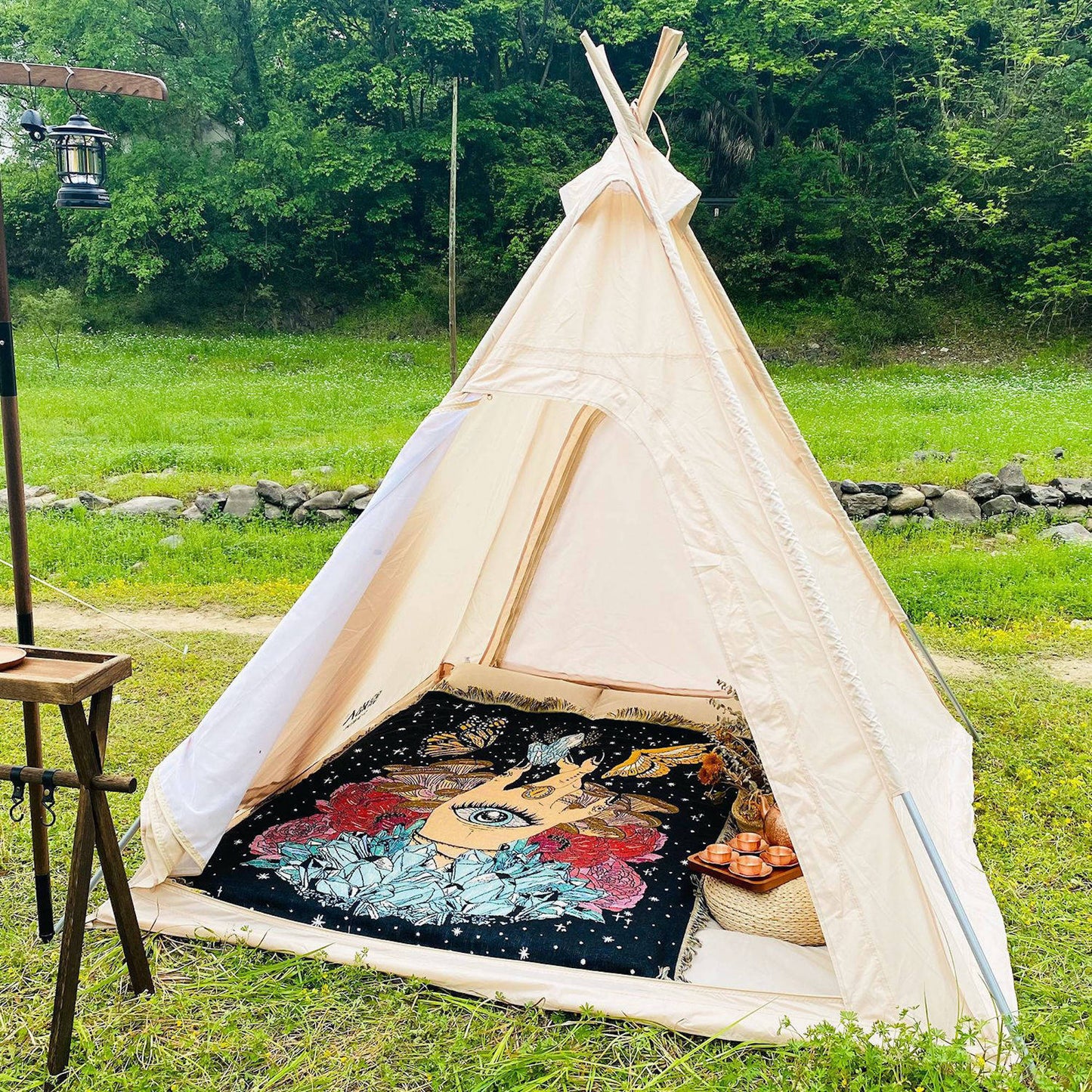 The Hand - Throw Blanket/Woven Tapestry laying out as a picnic blanket in a tent