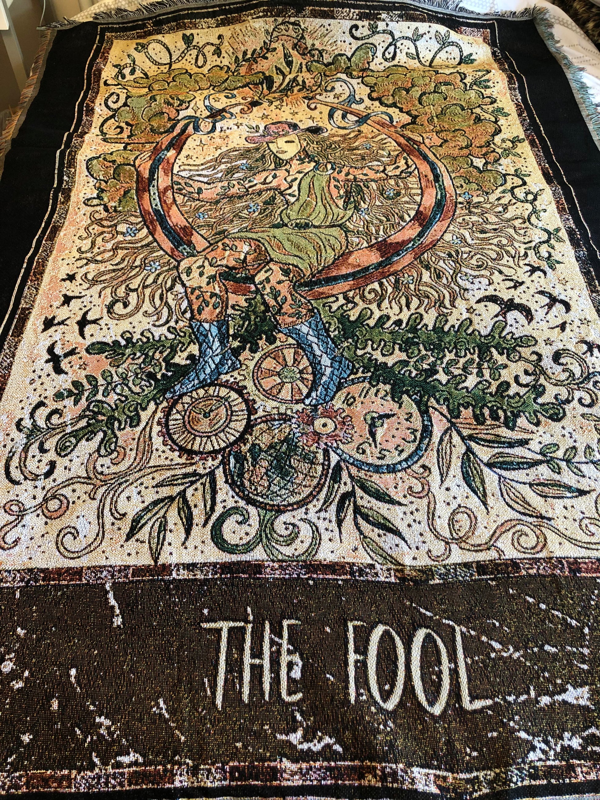 The Fool - Tarot Card Throw Blanket/ Woven Tapestry on a bed