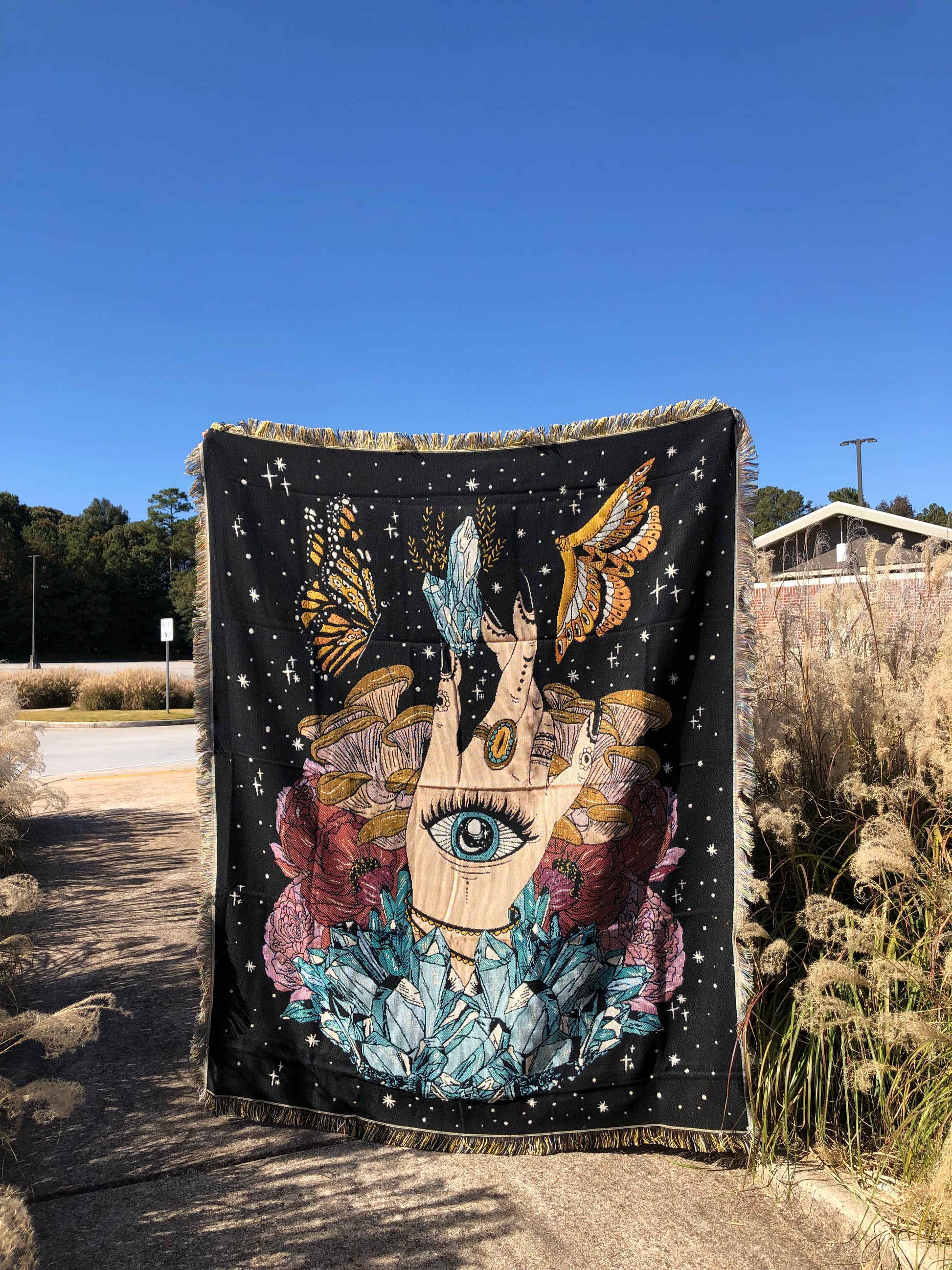 The Hand - Throw Blanket/Woven Tapestry holding up on a field