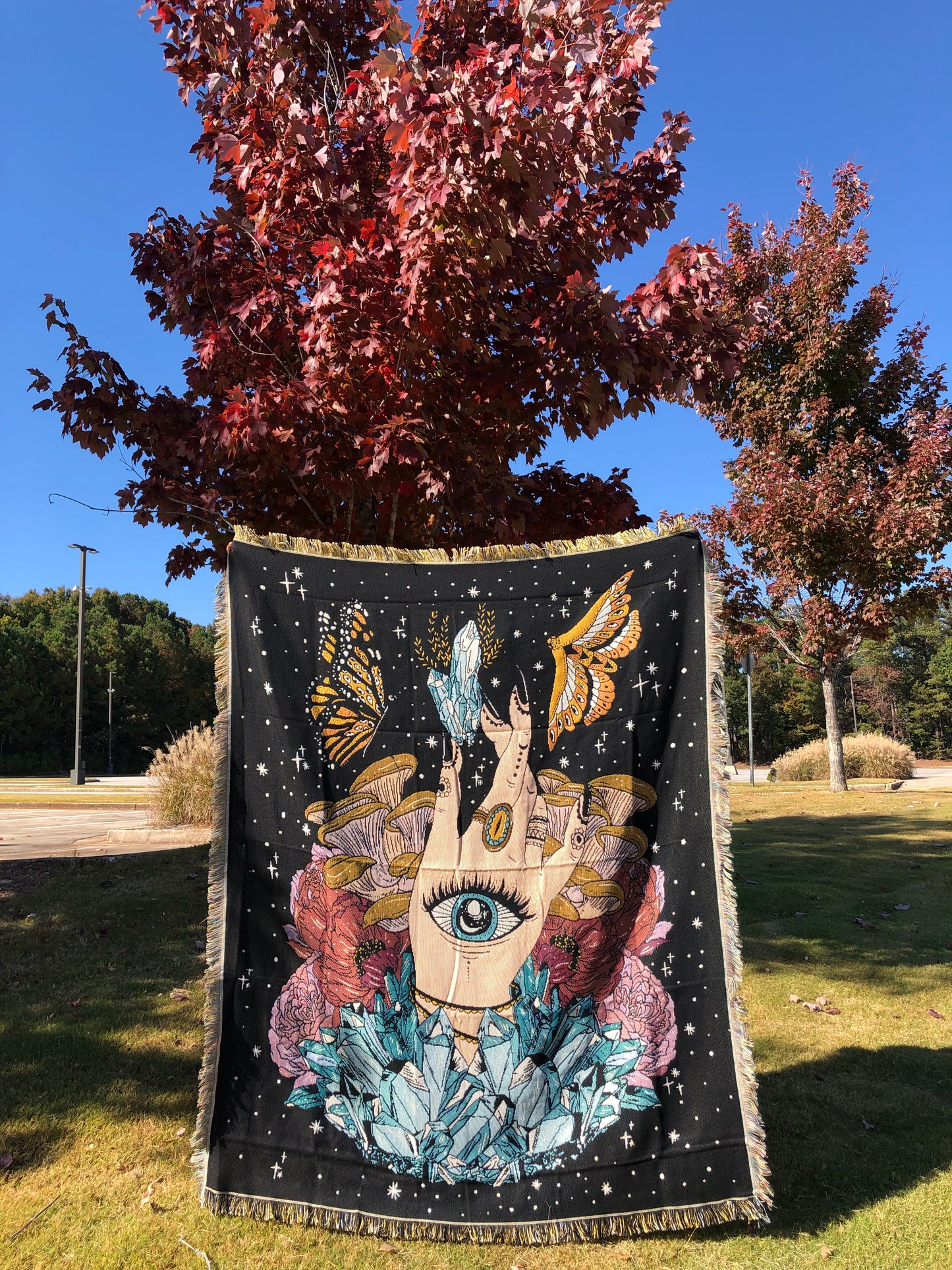 The Hand - Throw Blanket/Woven Tapestry in front of a red tree