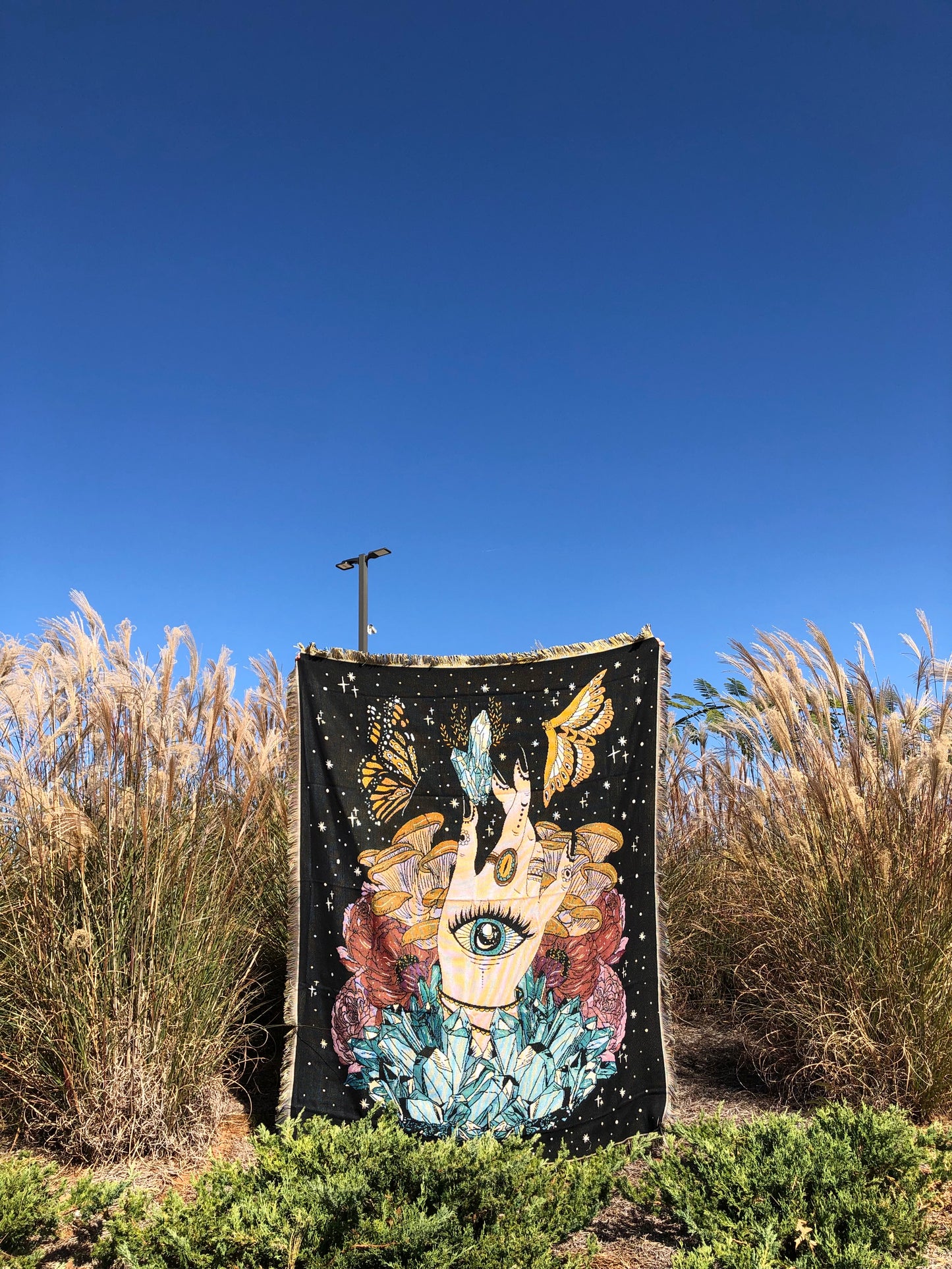 The Hand - Throw Blanket/Woven Tapestry in the middle of a field