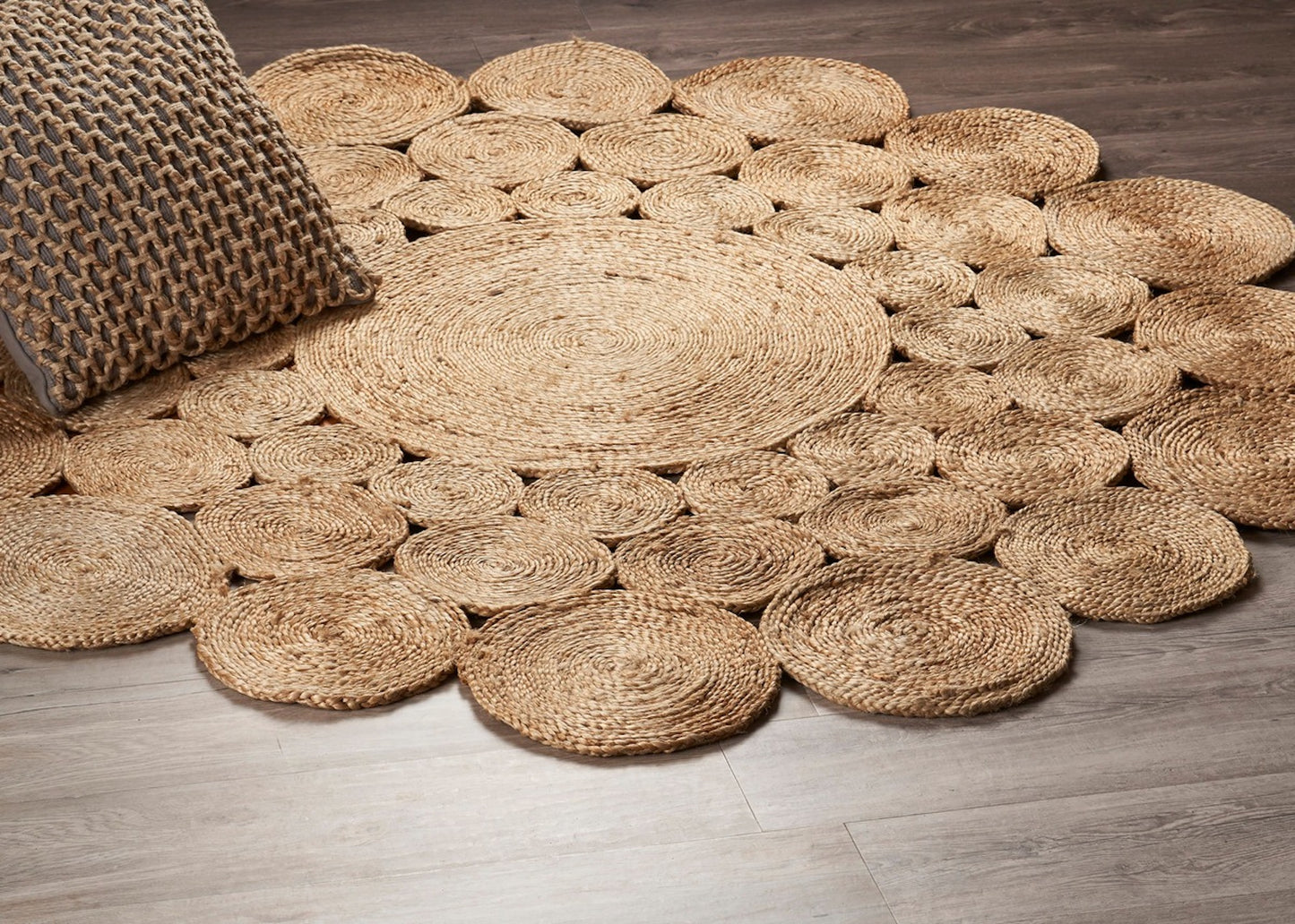 Circle Seagrass Rug on a wooden floor