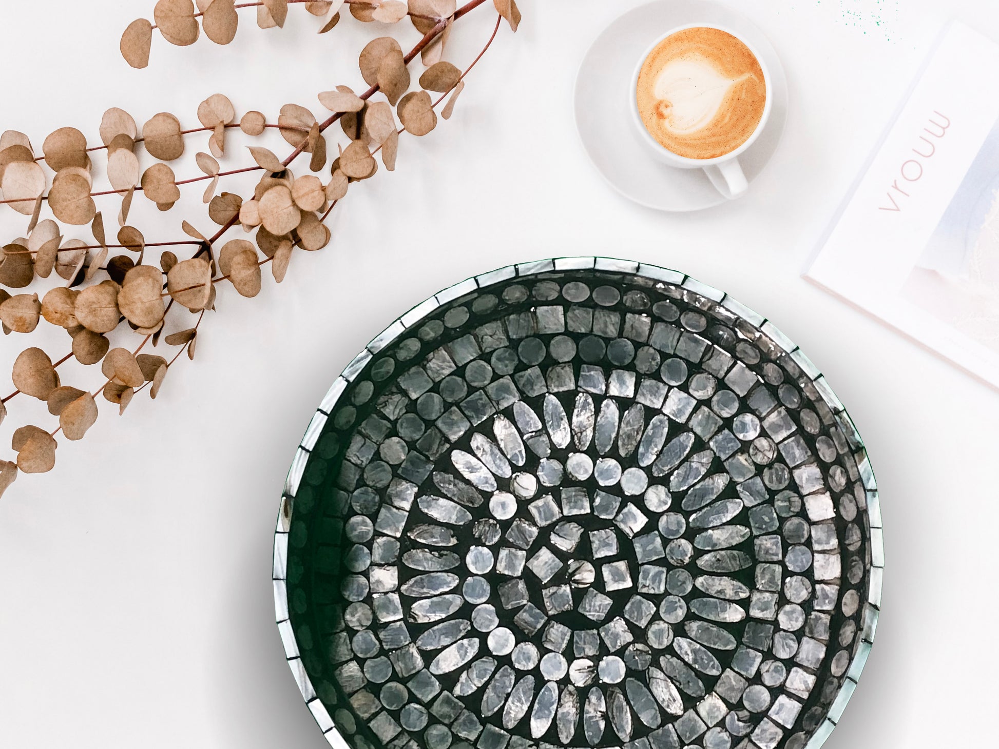 A top down shot of a Curvy Round Mother of Pearl Tray