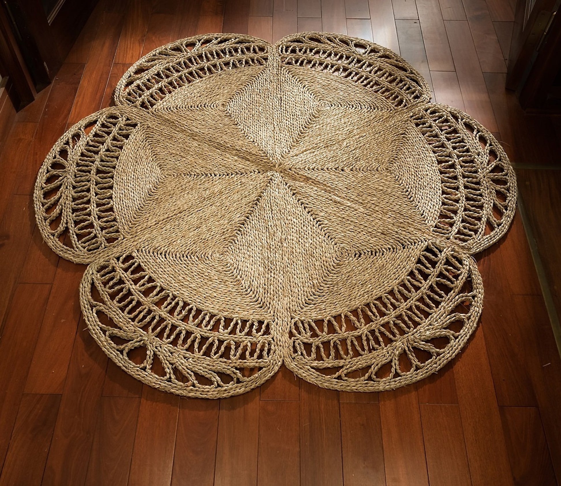 Flower Seagrass Rug on a wooden floor