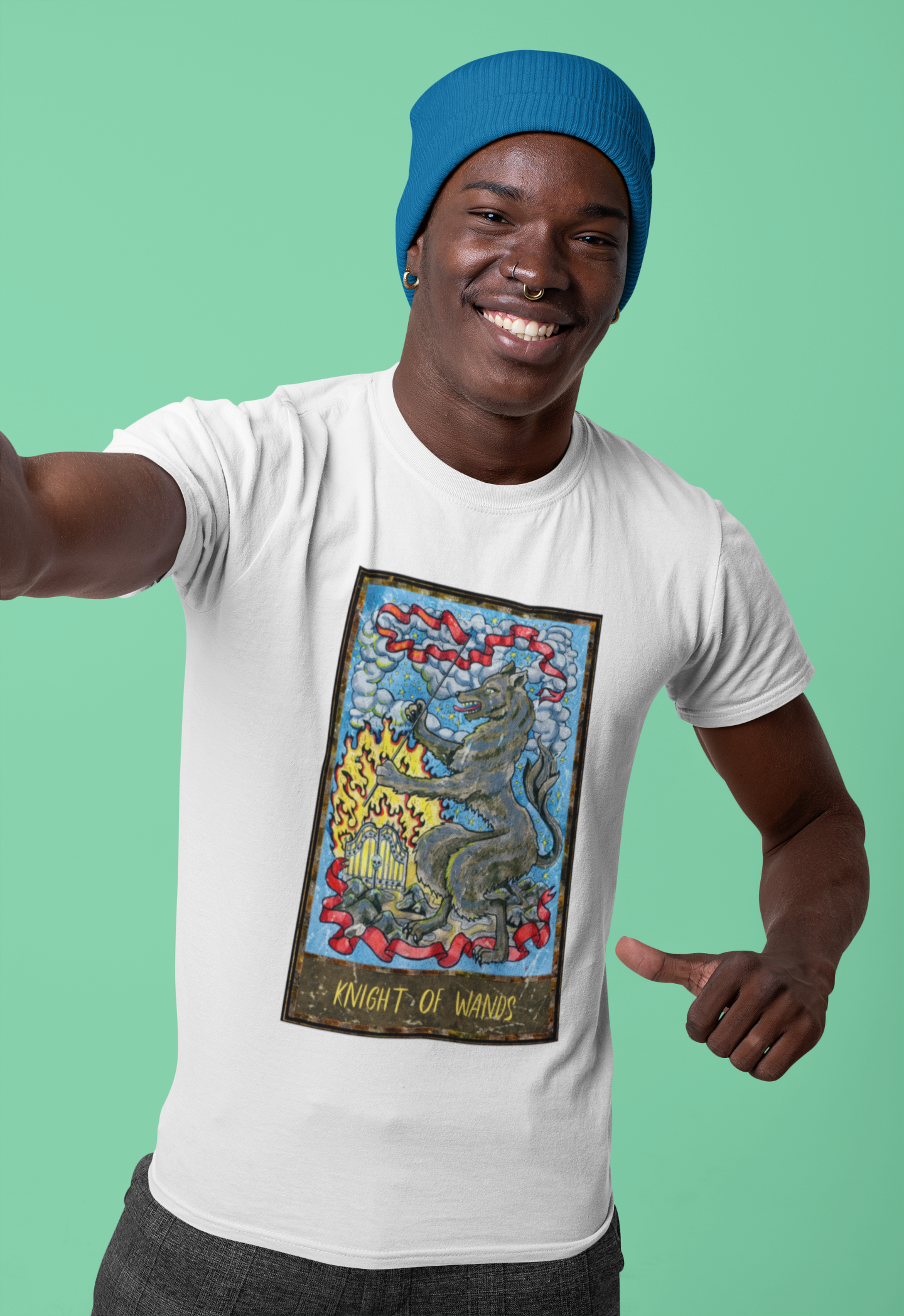 A man with blue beanie wearing a white Knight of Wands Tarot Card T-shirt