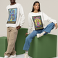 A man wearing a white  King of Pentacles Tarot Card Sweatshirt, beige jeans and white shoes. And a woman wearing a white Queen of Pentacles Tarot Card Sweatshirt, blue jeans and white shoes