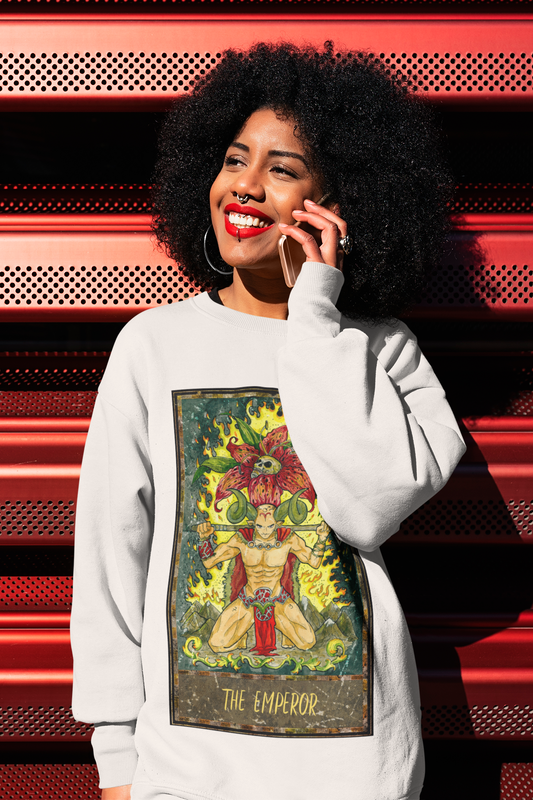 A woman talking on the phone wearing a white The Emperor Tarot Card Sweatshirt