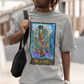 A man with sunglasses wearing a grey Page of Wands Tarot Card T-shirt, and beige pants, carry a black bag