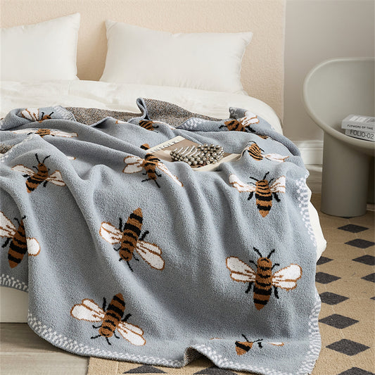 Bee Pattern Knitted Throw Blanket on a bed