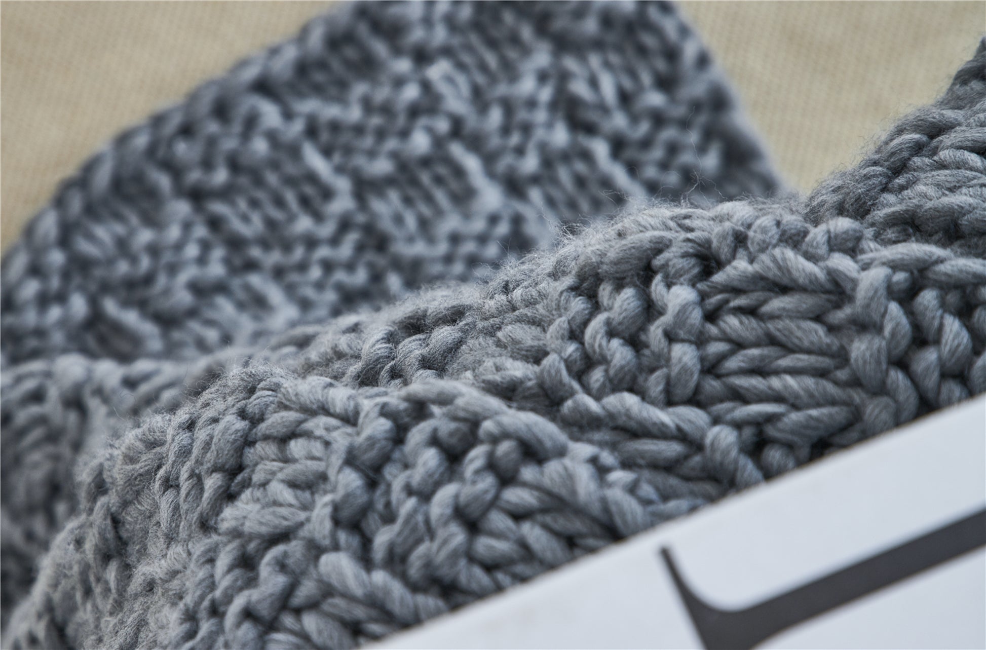 Close up shot of the Iceland Yarn Dark Gray Thick Knitted Throw Blanket