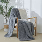 Iceland Yarn Dark Gray Thick Knitted Throw Blanket on a chair