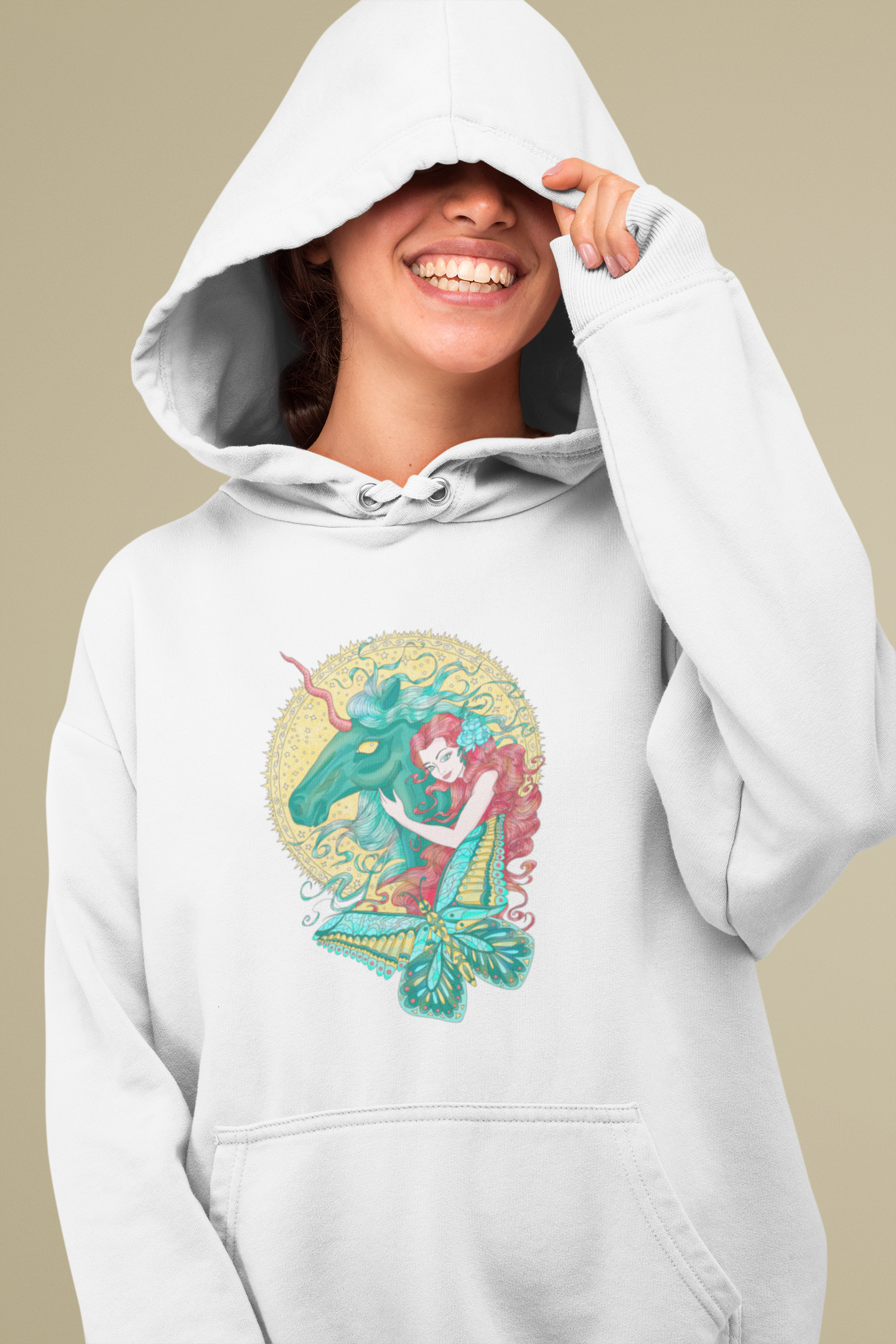 A laughing woman wearing a white Poppy Red Princess and Magic Unicorn Hoodie covering her eyes