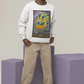 A man wearing a white Justice - Tarot Card Sweatshirt, beige pants, and white shoes