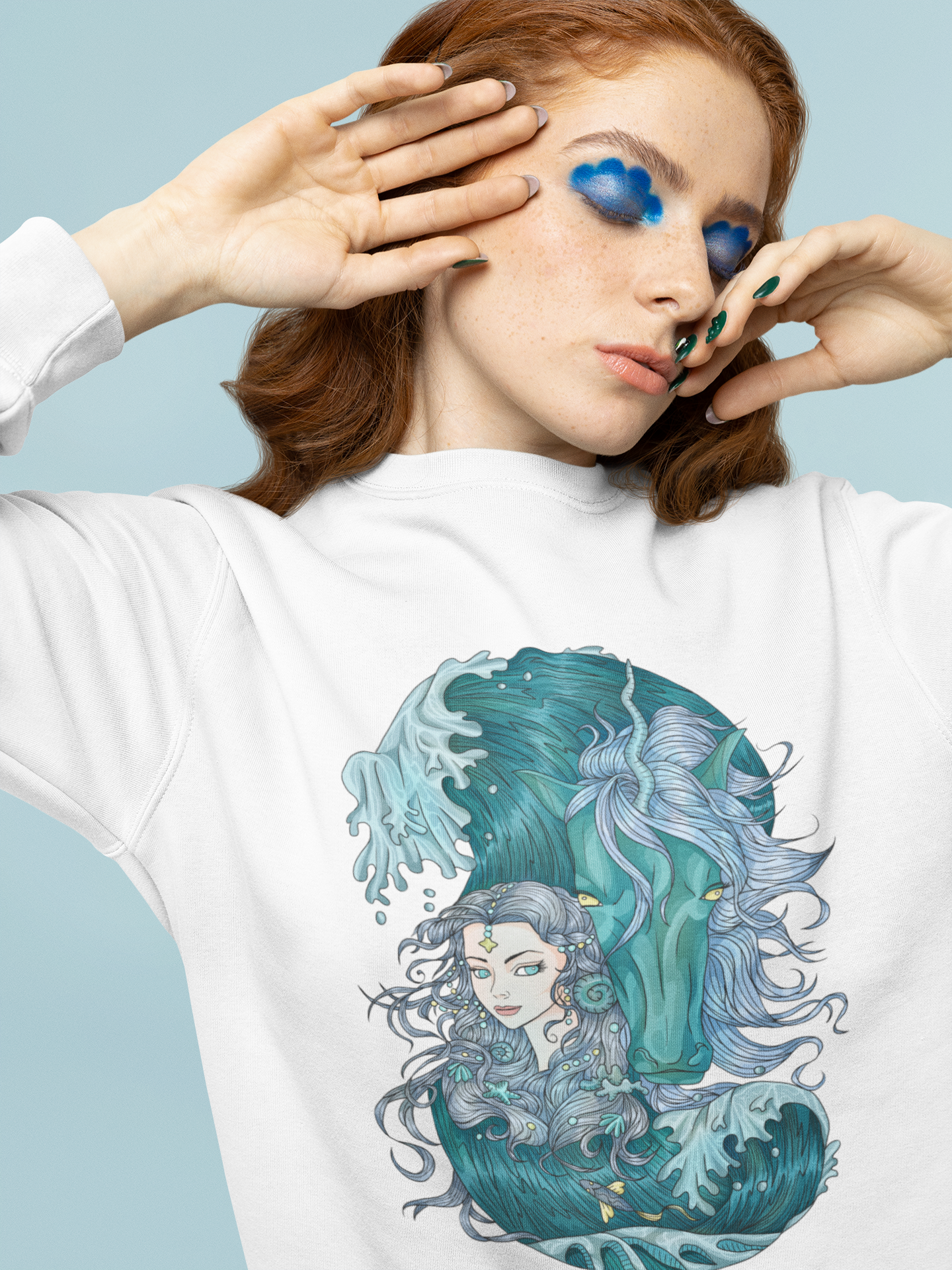 A woman with trendy makeup wearing a white Ice Blue Princess and Magic Unicorn Sweatshirt