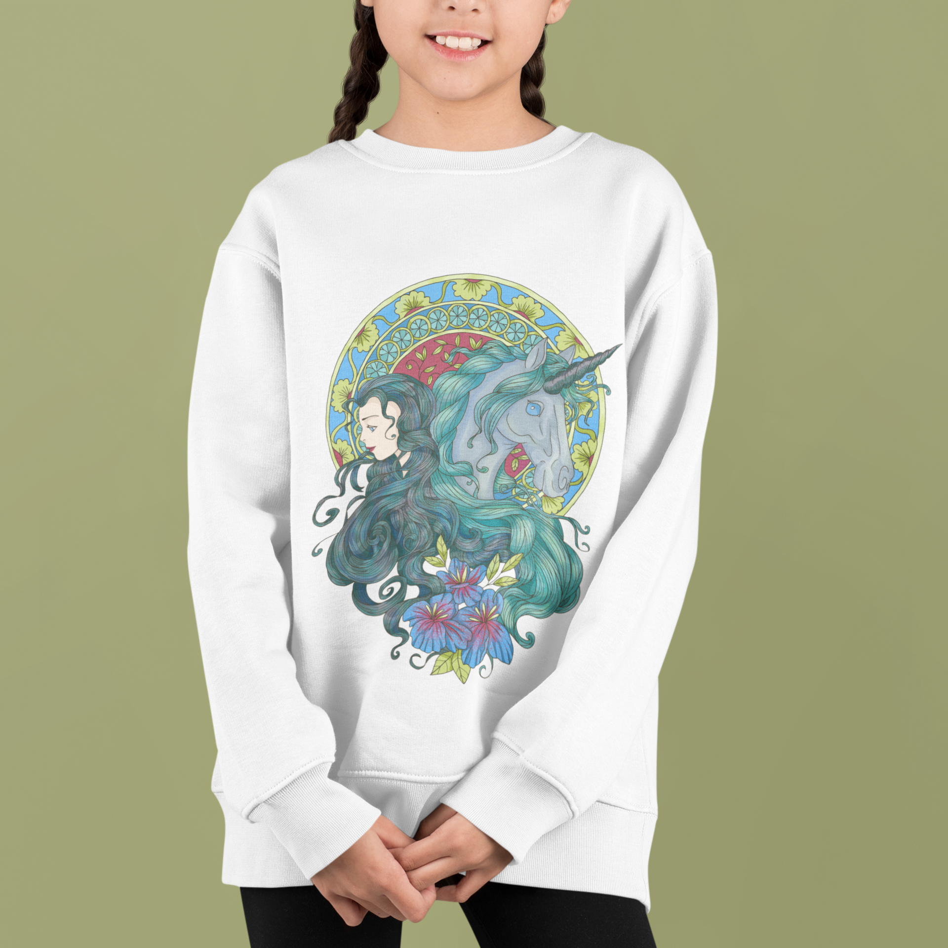 A little girl with braids standing in a studio with green background wearing a white Caribbean Current Princess and Magic Unicorn Sweatshirt and black pants