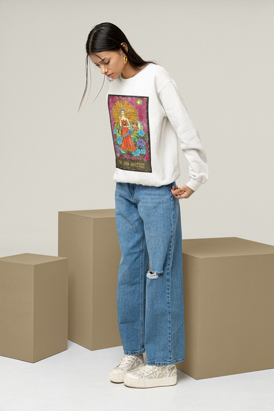 A woman wearing a white The High Priestess Tarot Card Sweatshirt, blue jeans with white shoes