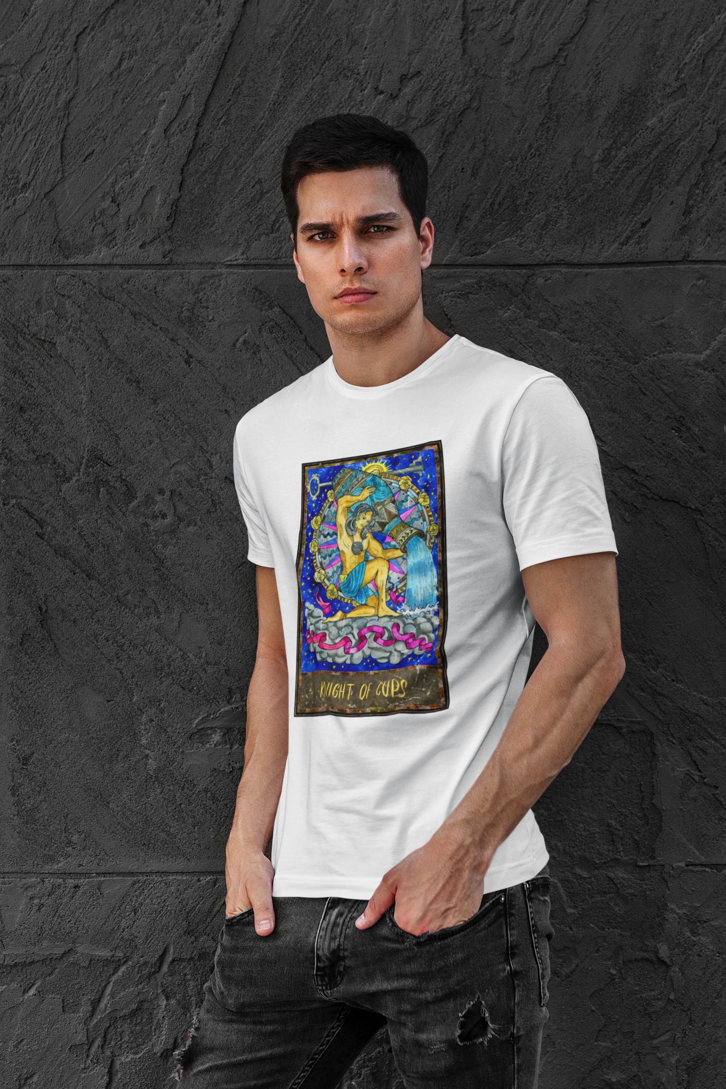 A man wearing a white Knight of Cups Tarot Card T-shirt and ripped black jeans