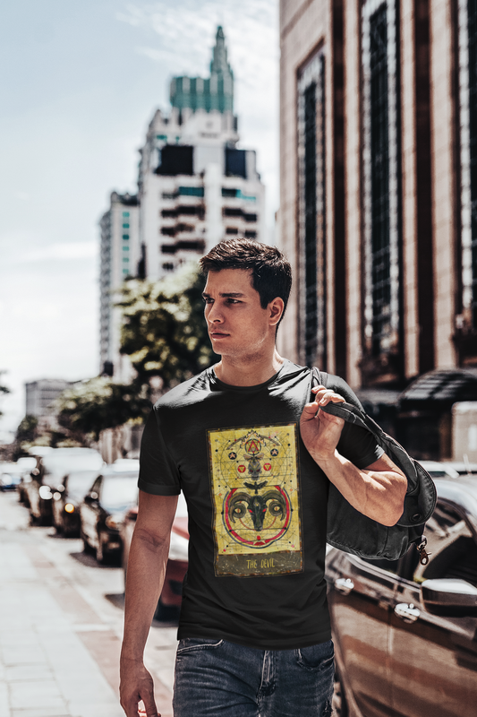 A young man with a backpack in his shoulder wearing a black The Devil Tarot Card T-shirt and dark blue jeans