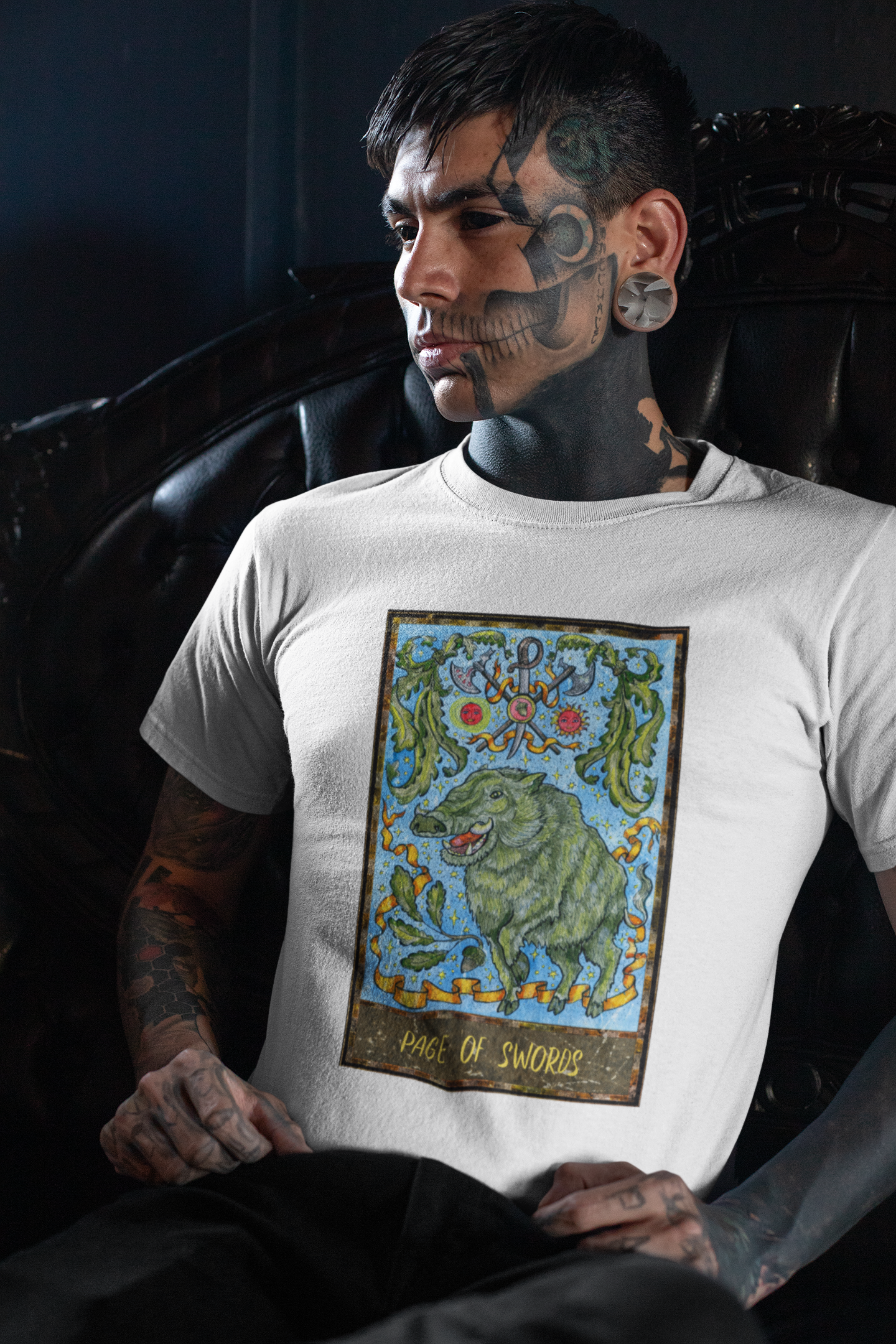 A man wearing a white Page of Swords Tarot Card T-shirt