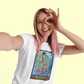 A pink haired woman posing for a selfie wearing a white Page of Wands Tarot Card T-shirt
