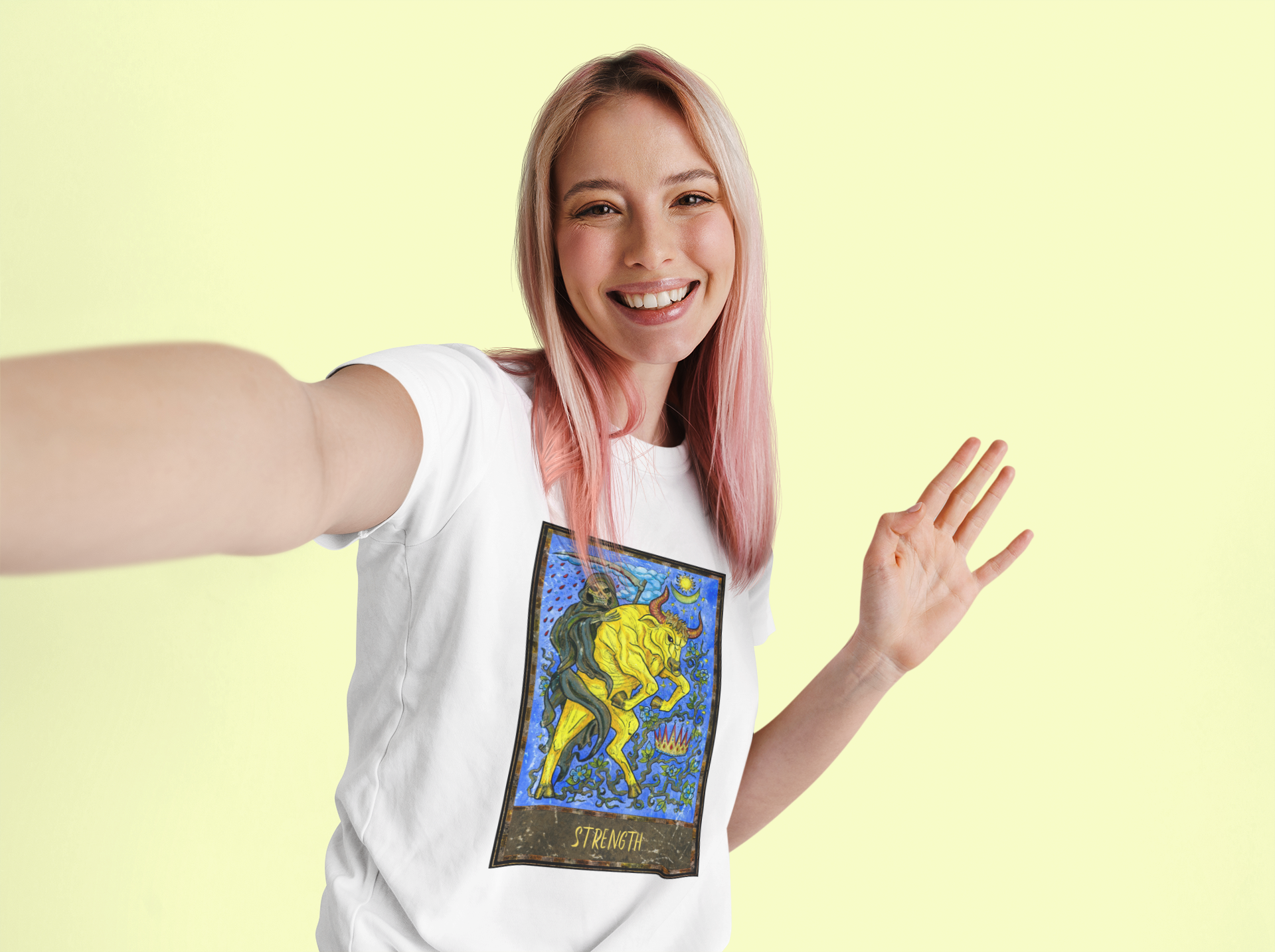 A woman with rose gold hair wearing a white Strength Tarot Card T-shirt