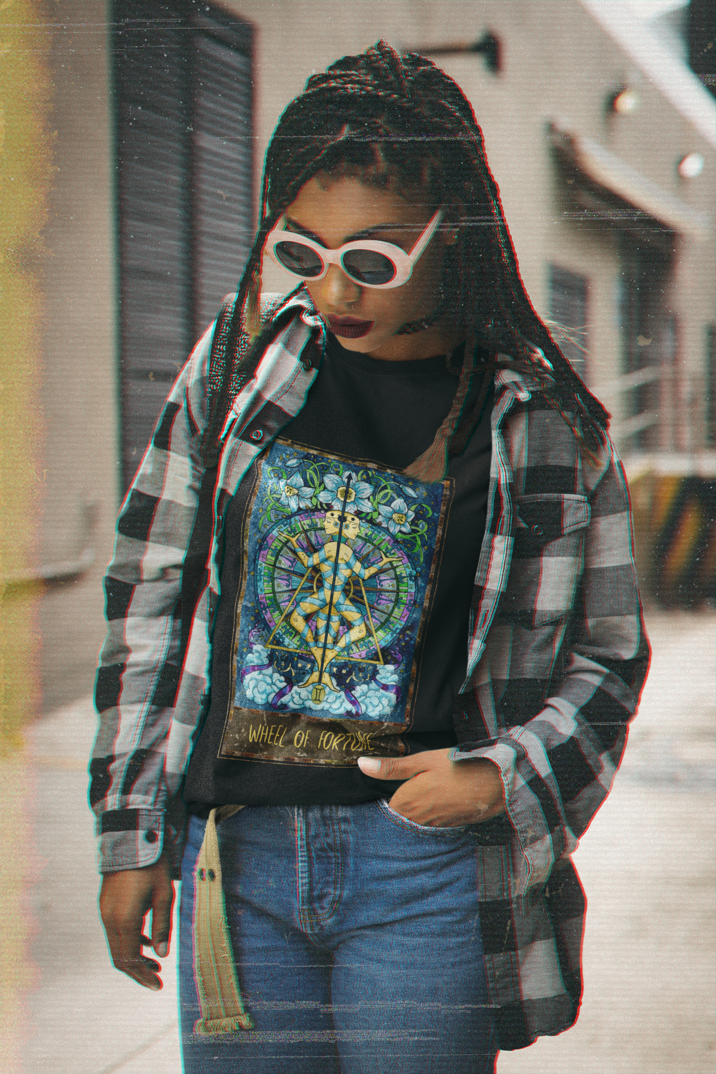 A woman wearing a black Wheel of Fortune - Tarot Card T-Shirt, check pattern collar shirt, and jeans