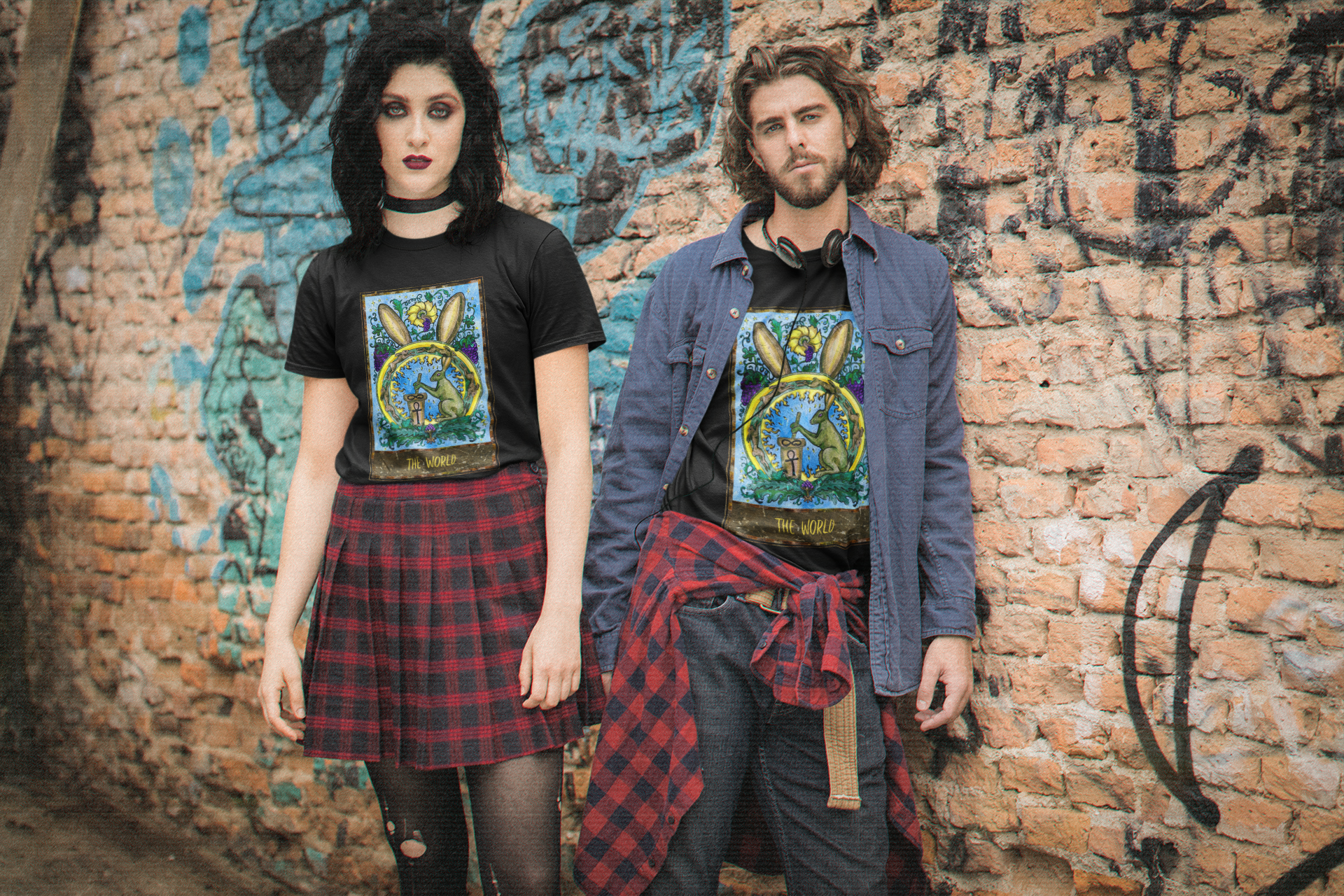 A couple wearing black The World Tarot Card T-Shirts with a coordinated look